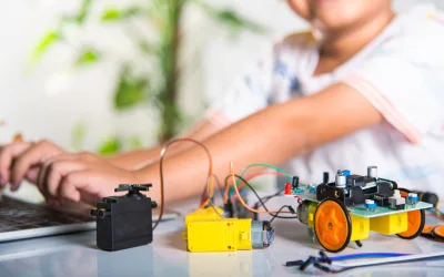 Asian kid boy learns coding and programming with laptop for Ardu