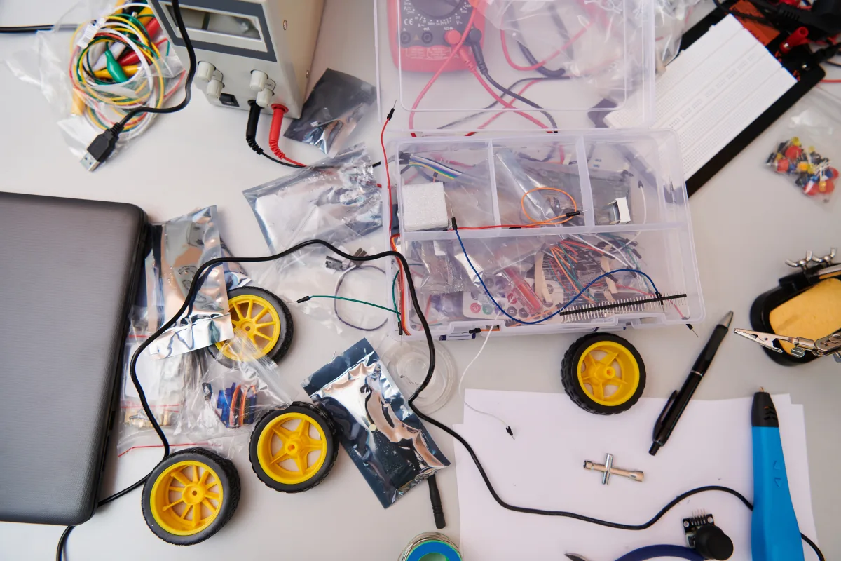 Various components and installations for robot fabrication fill the space, representing the intricate blend of technology, engineering, and innovation involved in the development and assembly of advanced robotic systems.